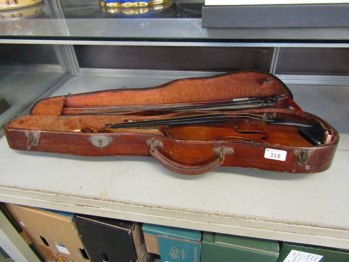A 20th century violin in hard carry case with two bows (One bow damaged)