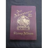 An early 20th century stamp album containing a quantity of stamps