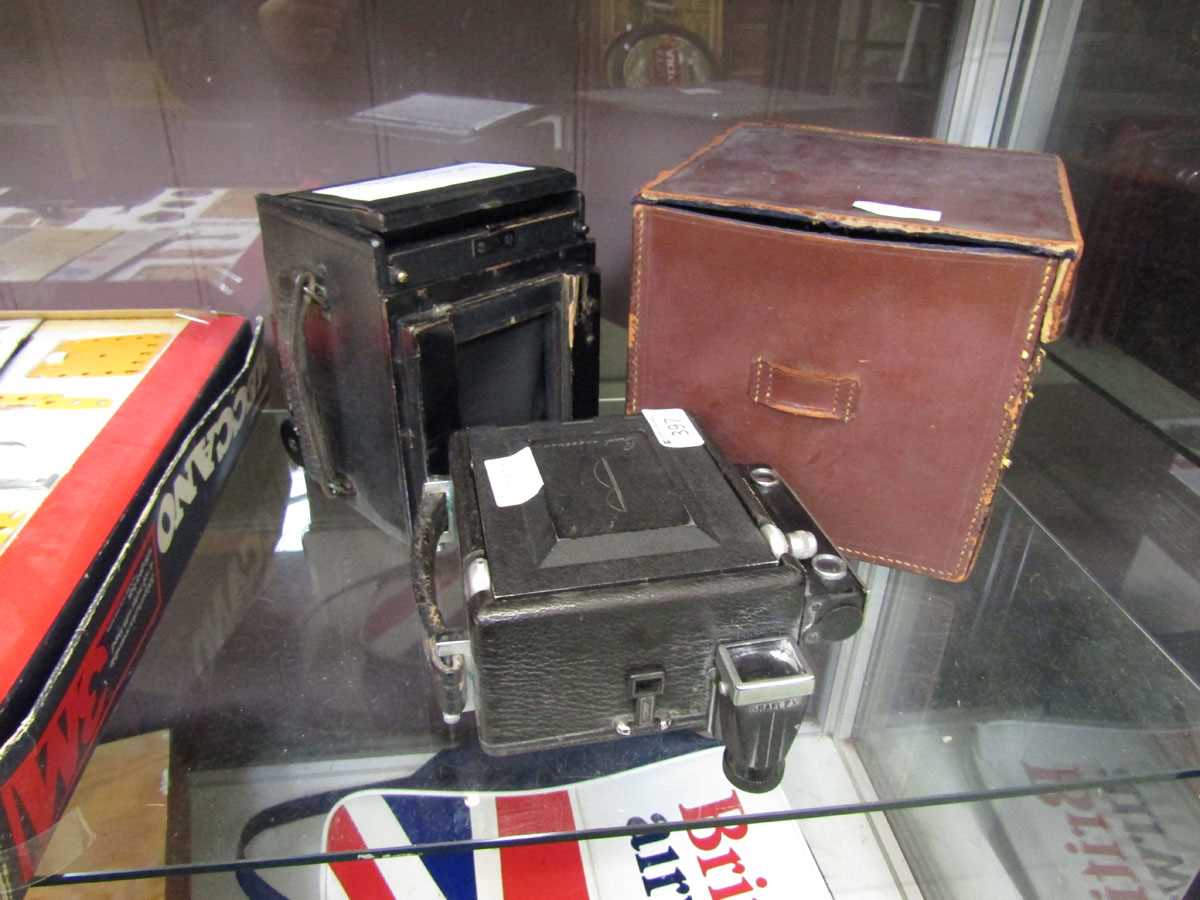 A Thornton's Pickard Junior Special Quarter Plate camera together with a Busch press camera
