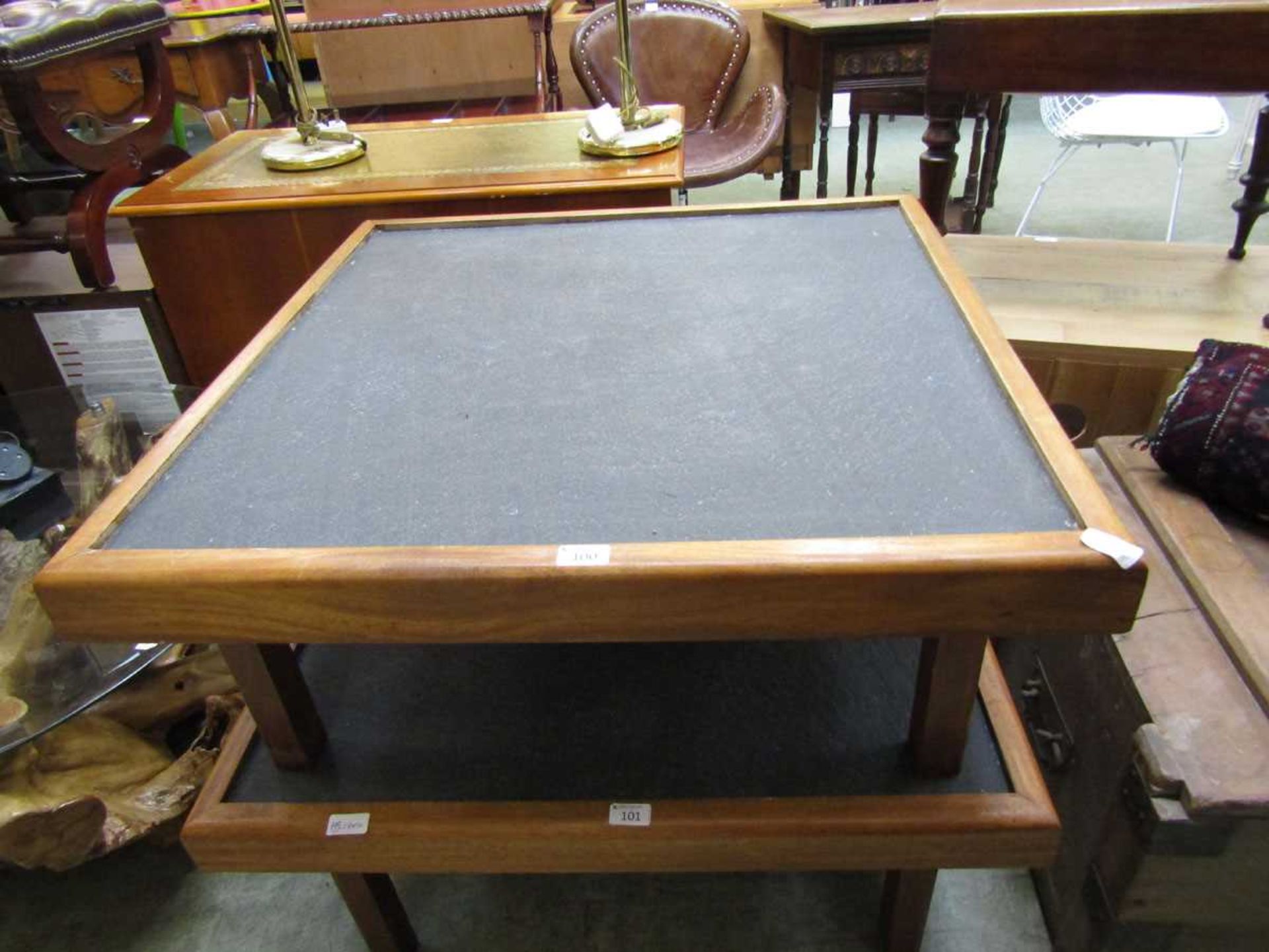 A mid-20th century teak low level table with slate top