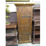 An Indonesian hardwood gothic style cupboard having an arch topped chapel style door