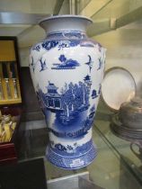 An oriental style blue and white vase