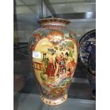 A large Satsuma style ceramic vase with decoration depicting family scene