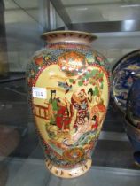 A large Satsuma style ceramic vase with decoration depicting family scene