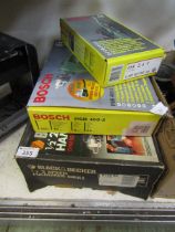 A boxed rechargeable Bosch screwdriver, Bosch drill and a Black & Decker boxed hammer drill