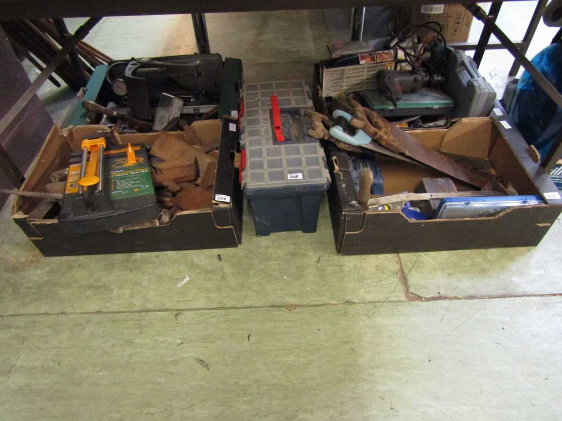 A large selection of four boxes and a toolbox containing hand tools to include moulding planes,