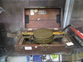 A cased compass, the box being marked J. Casartelli & Son Ltd.