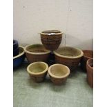 A selection of six brown glazed garden pots