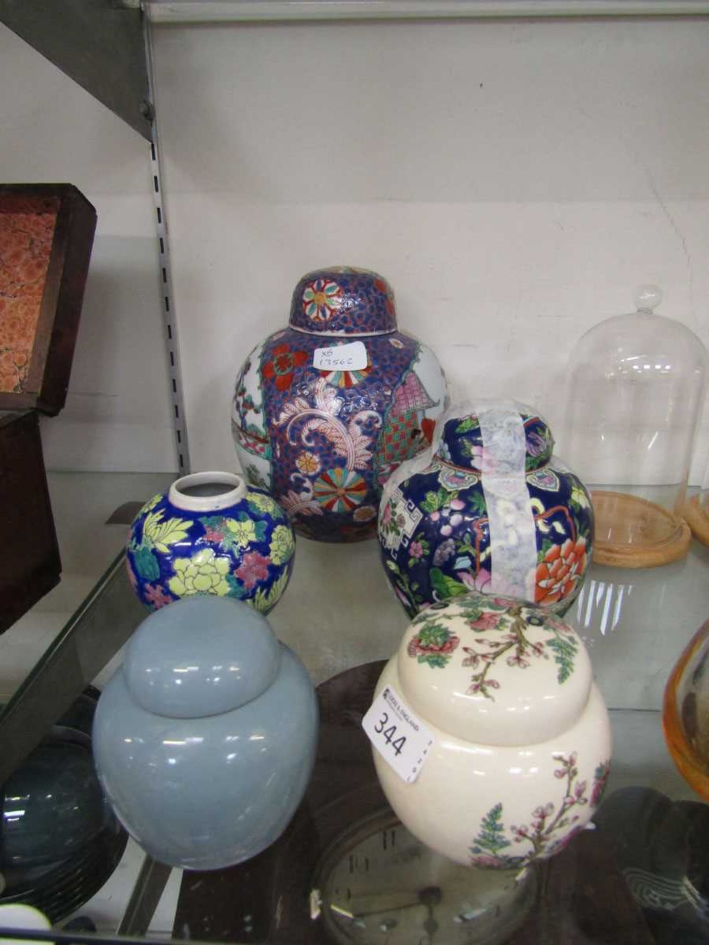 Five ginger jars, one minus lid, to include Sadler floral decorated jar, plain blue ground jar,