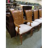 A set of four standard and three carver walnut framed dining chairs with bergere backs For courier