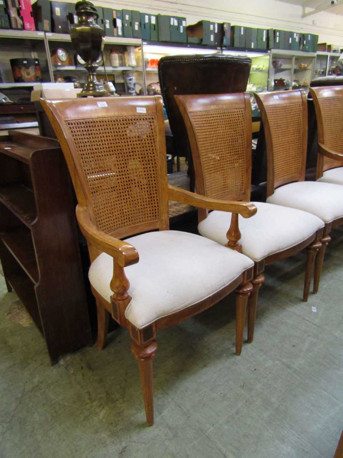 A set of four standard and three carver walnut framed dining chairs with bergere backs For courier