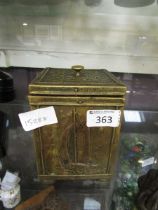 A hammered brass tea caddy with lining