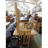 A modern oak extending dining table together with a set of six matching chairs Possible adhesive