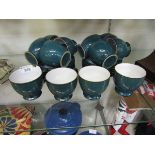 A set of twelve blue ground mid-20th century style teacups and saucers by Denby