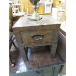 A reproduction rough cut wooden cabinet with single drawer