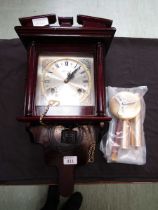 A reproduction drop dial wall clock