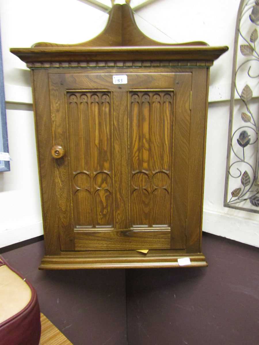 An Ercol wall mounted corner cupboard