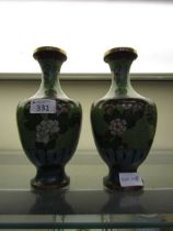 A pair of blue and green ground cloisonné vases with white floral decoration