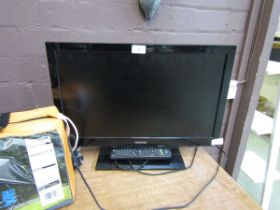 A small Toshiba television receiver with remote