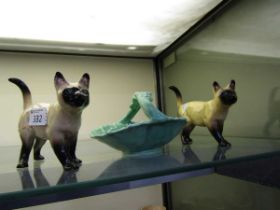A Sylvac leaf design basket along with two ceramic figurines of Siamese cats