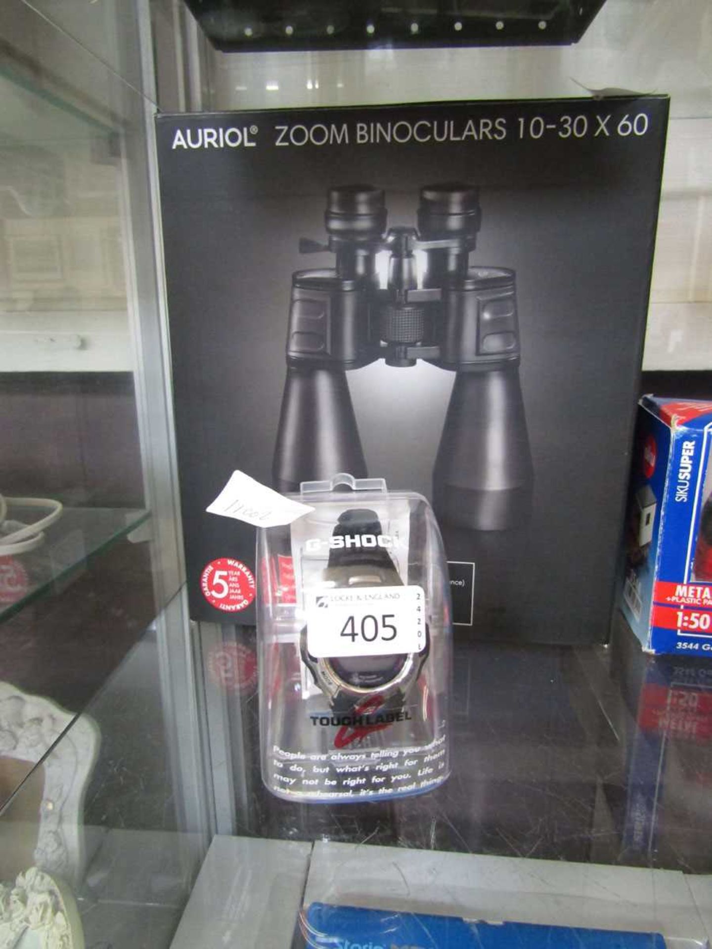 A pair of 10-30 x 60 binoculars together with a gent's Casio G-Shock watch