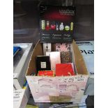 A boxed containing a quantity of various used and unused perfumes Appear to be mostly used.