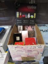 A boxed containing a quantity of various used and unused perfumes Appear to be mostly used.