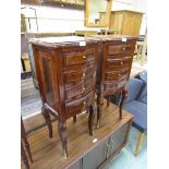 A pair of reproduction French style serpentine fronted four drawer chests