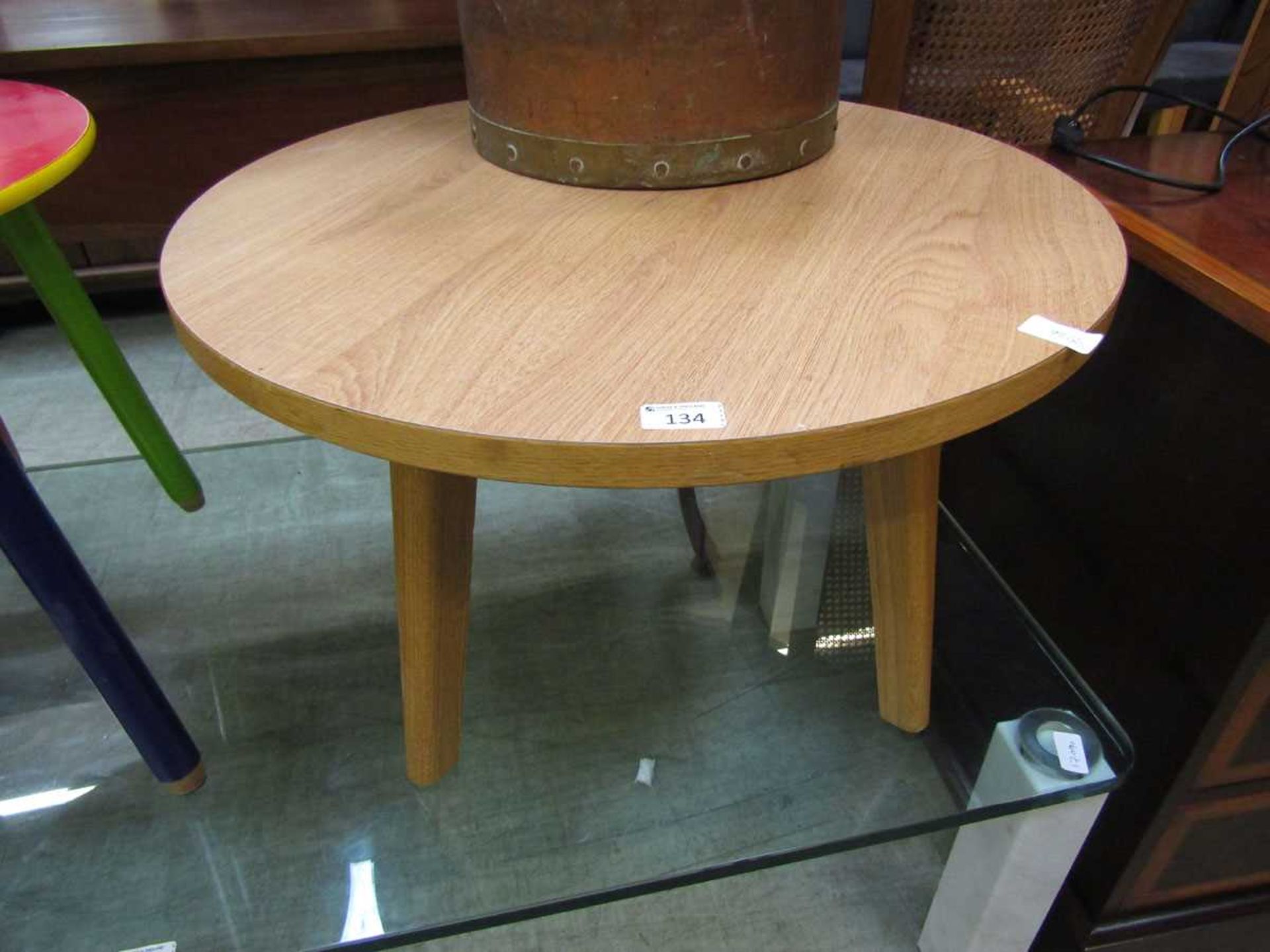 A laminated circular occasional table with 20th century design