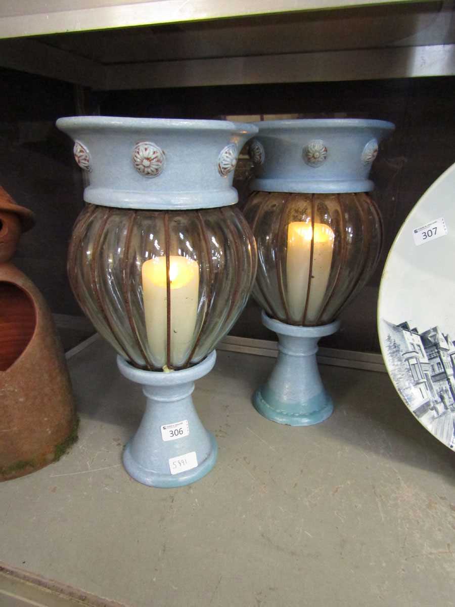 A pair of blue bubble glass candle holders