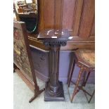 A mahogany columned jardiniere stand Height; 103cm. Minor marks and scratches present, No apparent