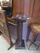 A mahogany columned jardiniere stand Height; 103cm. Minor marks and scratches present, No apparent