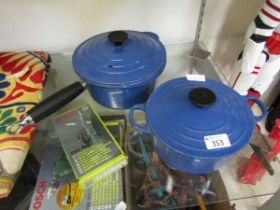Two blue Le Creuset pots No apparent cracks or chips seen. Some marks to cast iron rim.