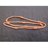 An orange coral style necklace