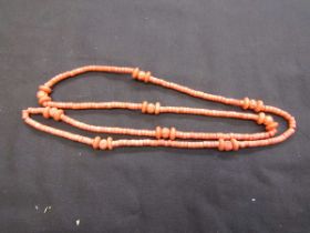 An orange coral style necklace