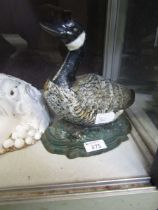 A cast metal door stop in the form of a goose Dimensions: H, 22cm , W, 20cm , D, 10cm. No apparent