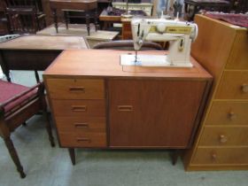 A mid-20th century teak cased Singer electric sewing machine No power supply.