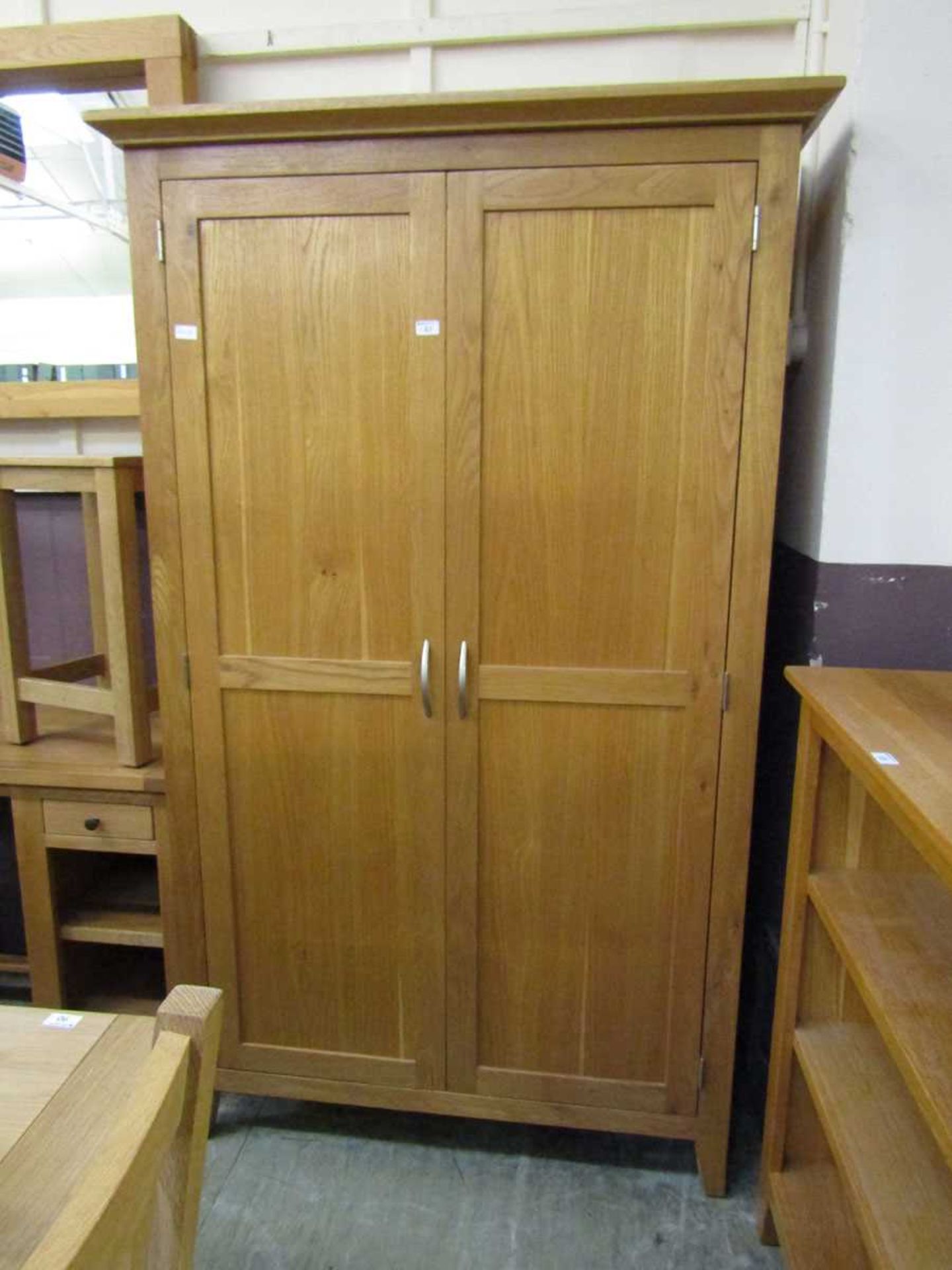 A modern oak two door wardrobe