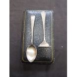 A silver hallmarked spoon and food pusher in case