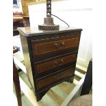 A reproduction mahogany chest of three drawers of small proportions