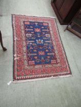 An eastern red and blue ground rectangular rug