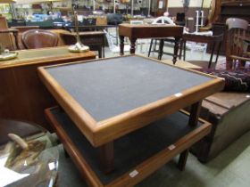 A mid-20th century teak low level table with slate top