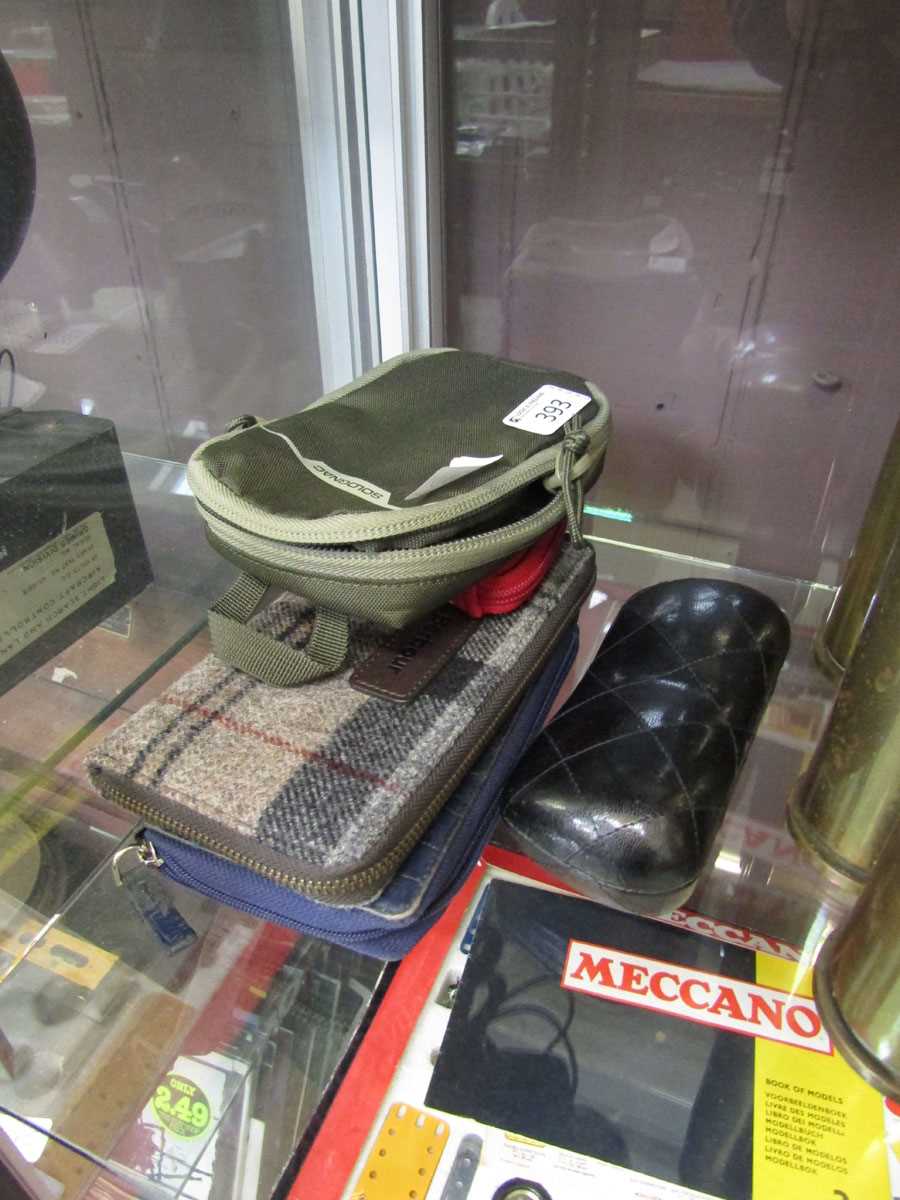 A selection of modern purses and glass cases