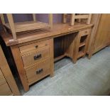 A modern oak twin pedestal dresser base having open storage being flanked by drawers and open