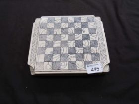 A marble travelling chess set with board to lid of box