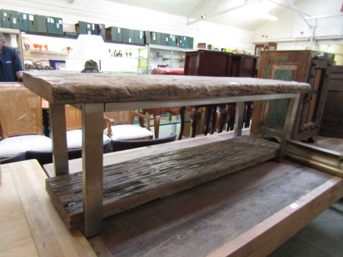 A modern driftwood topped metal based bench with matching under tier