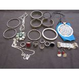 A bag containing a quantity of white metal modern jewellery to include rings, bangles, pendants,
