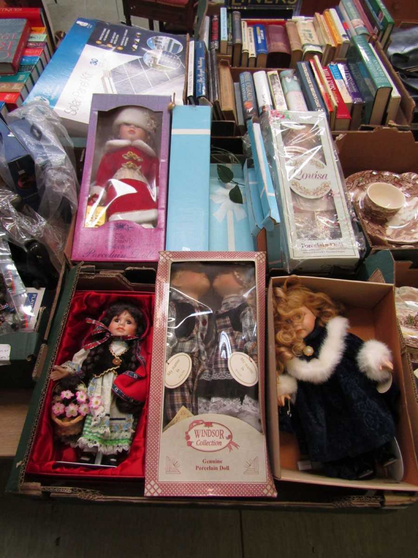 Two trays of costume dolls