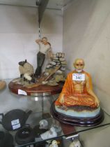 A moulded figure of Indian monk along with a moulded figural group titled to base 'A Thoughtful