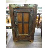 A modern distressed wooden pot cupboard